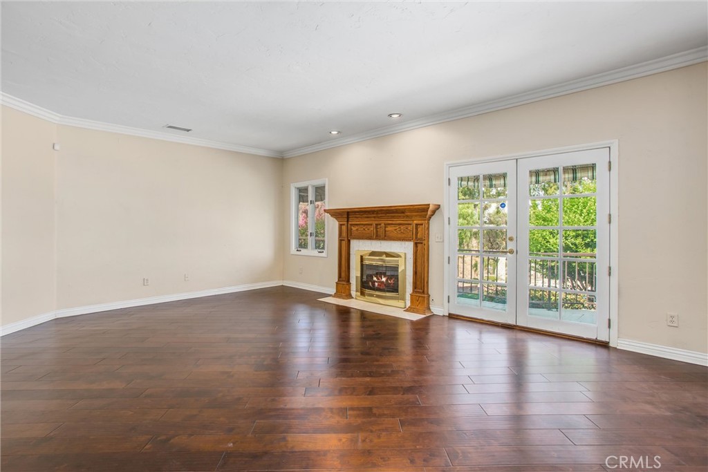 6966 Ranch View Road Riverside, CA 92506 - Photo 16 of 73 wooden floor in an empty room with a window