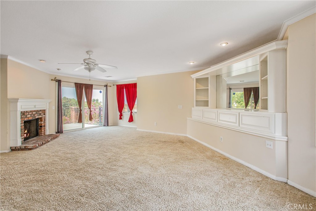 6966 Ranch View Road Riverside, CA 92506 - Photo 29 of 73 a view of an empty room with a fireplace and a window
