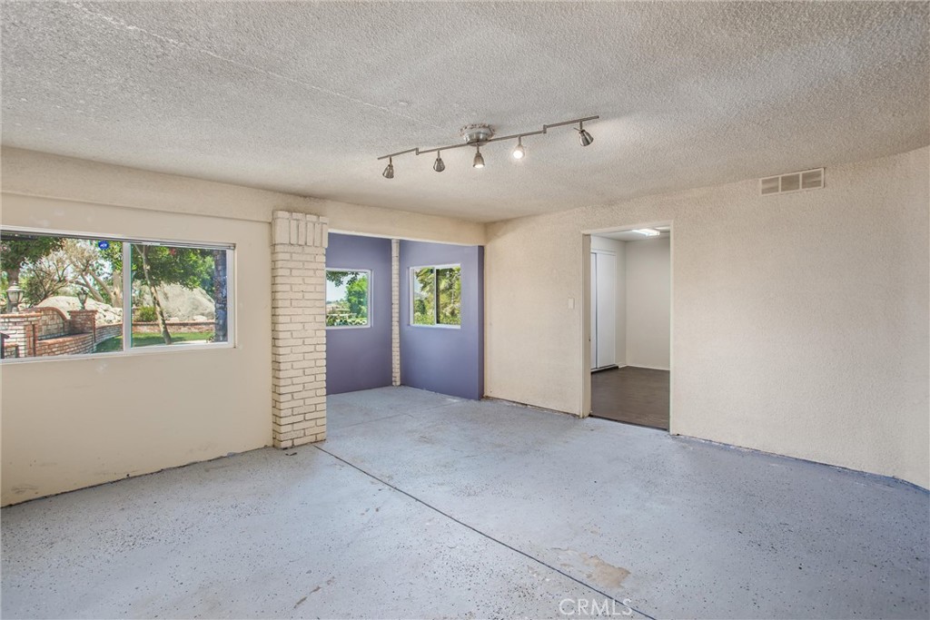 6966 Ranch View Road Riverside, CA 92506 - Photo 47 of 73 a view of an empty room with a window