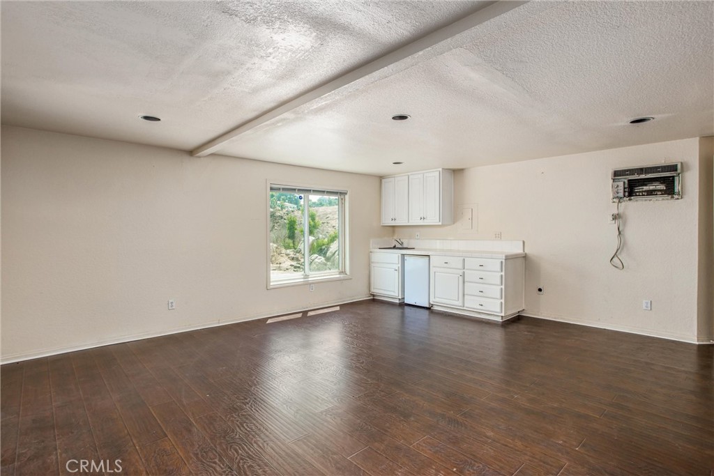 6966 Ranch View Road Riverside, CA 92506 - Photo 53 of 73 a view of a kitchen with wooden floor and a window