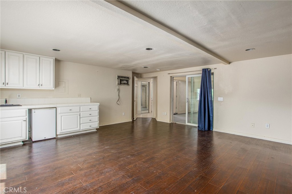 6966 Ranch View Road Riverside, CA 92506 - Photo 54 of 73 a view of an empty room with wooden floor