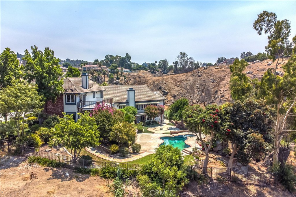 6966 Ranch View Road Riverside, CA 92506 - Photo 69 of 73 a view of a house with a yard and garden