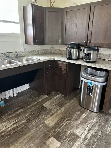 a kitchen with a sink and a stove