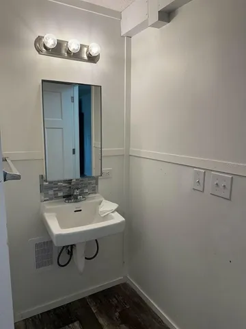 a bathroom with a sink and vanity