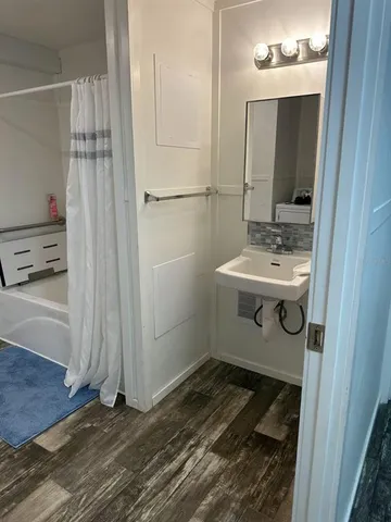 a bathroom with a sink and mirror