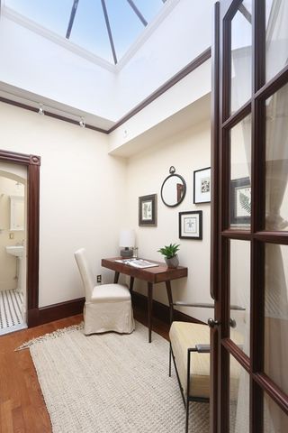 a bedroom with furniture and a window