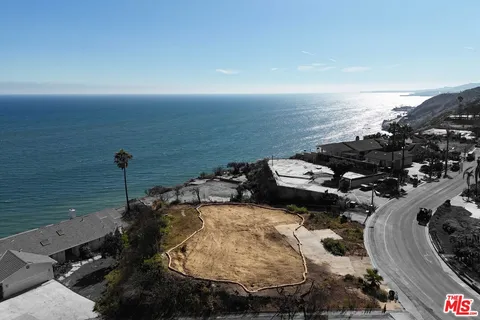 an aerial view of a house with outdoor space