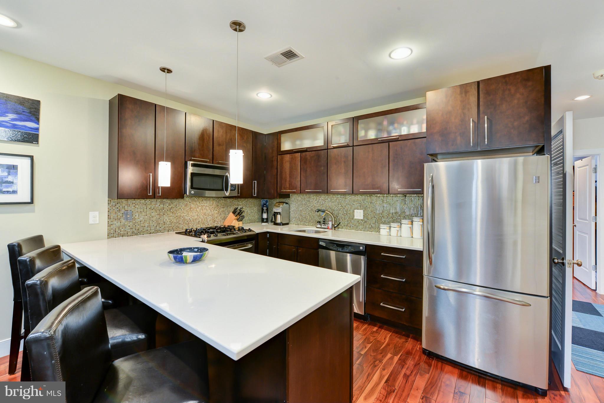 Kitchen showing breakfast bar