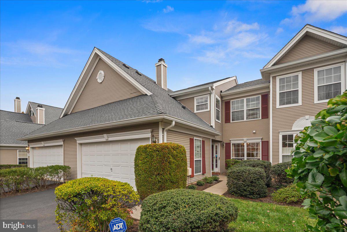 316 Watkins Road Pennington, NJ 08534 - Photo 1 of 37 a view of a house with a small yard and plants