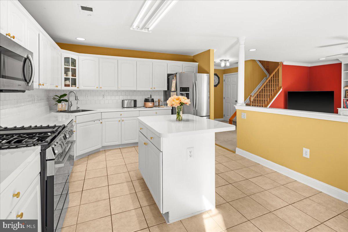 316 Watkins Road Pennington, NJ 08534 - Photo 14 of 37 a kitchen with a sink a stove top oven a counter space and cabinets