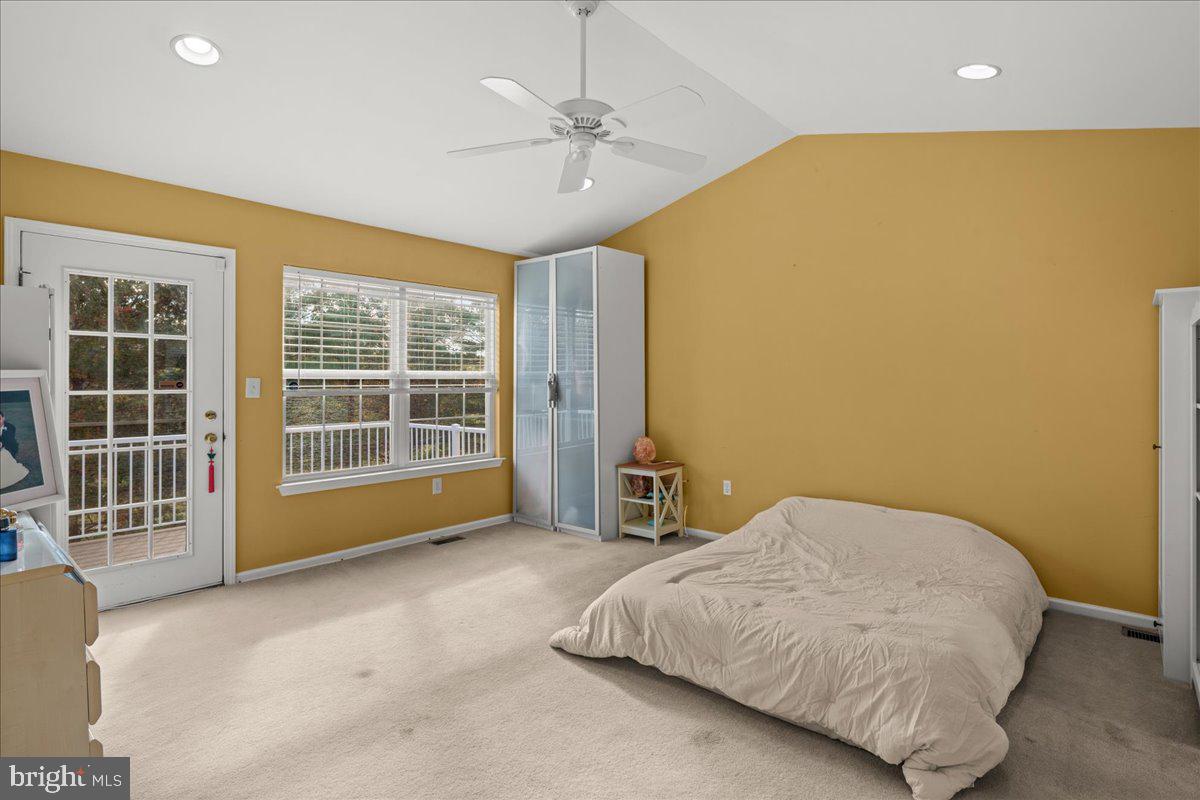 316 Watkins Road Pennington, NJ 08534 - Photo 18 of 37 a spacious bedroom with a bed and glass windows