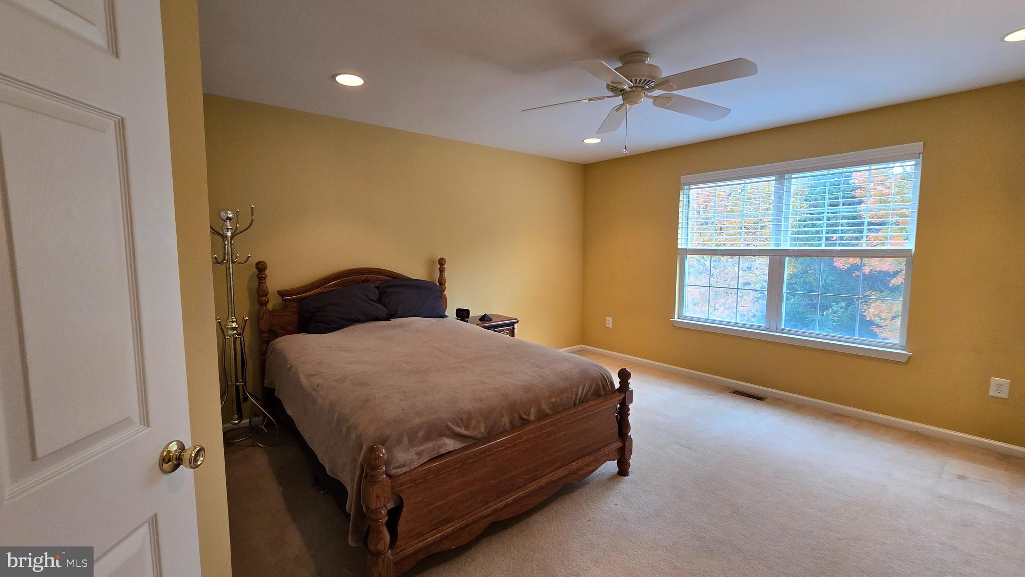 316 Watkins Road Pennington, NJ 08534 - Photo 24 of 37 a spacious bedroom with a bed and a window