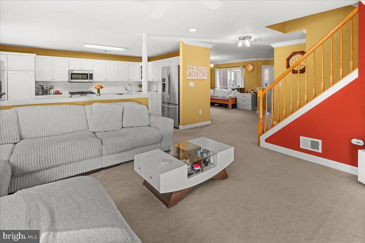 316 Watkins Road Pennington, NJ 08534 - Photo 10 of 37 a living room with furniture and kitchen view