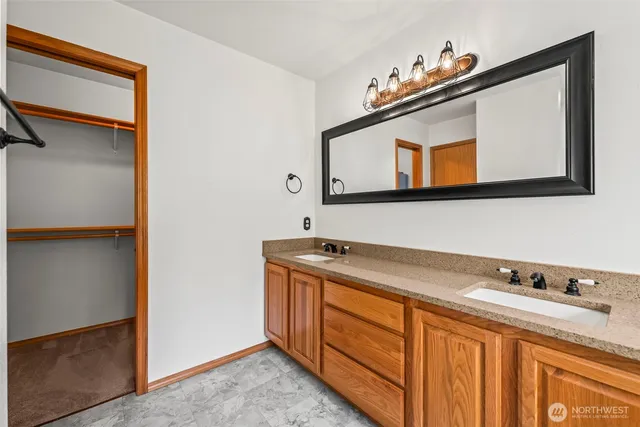 a view of a room with rack on the wall and a window