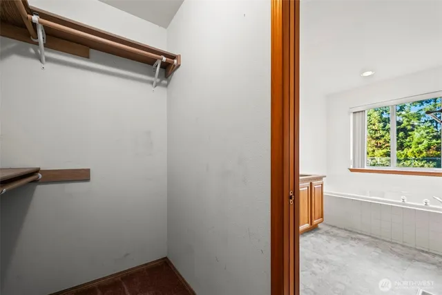 a utility room with stainless steel appliances granite countertop a stove a sink and a microwave