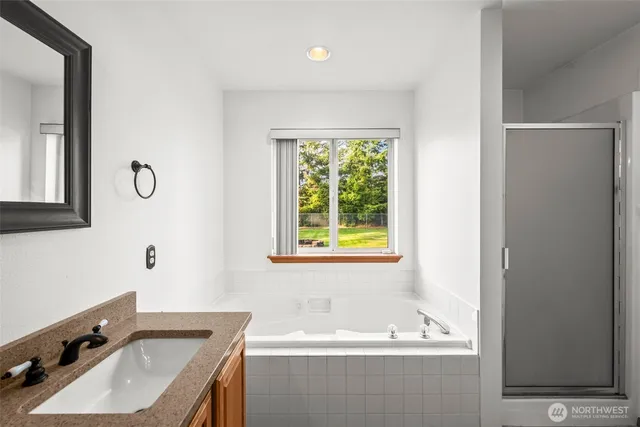 a bath tub sitting next to a window