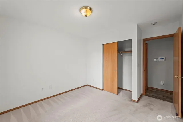 a bathroom with a granite countertop toilet a sink and a bathtub