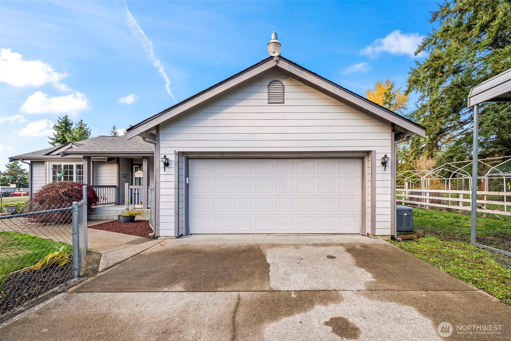 9117 336th Street South Roy, WA 98580 - Photo 2 of 38 a front view of a house with a yard