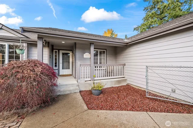 a view of a house with a small yard and plants