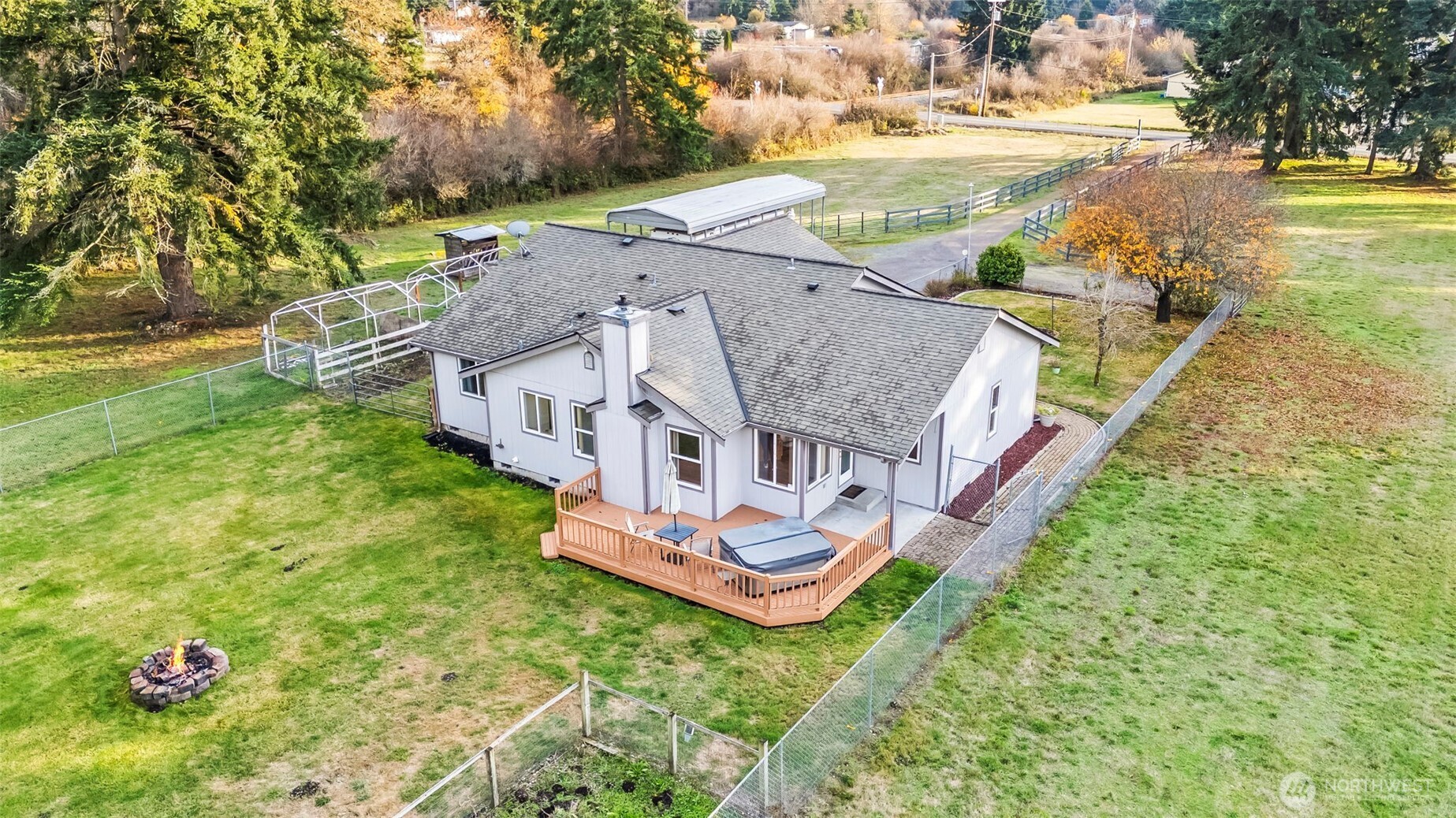 9117 336th Street South Roy, WA 98580 - Photo 31 of 38 an aerial view of a house with a garden and lake view