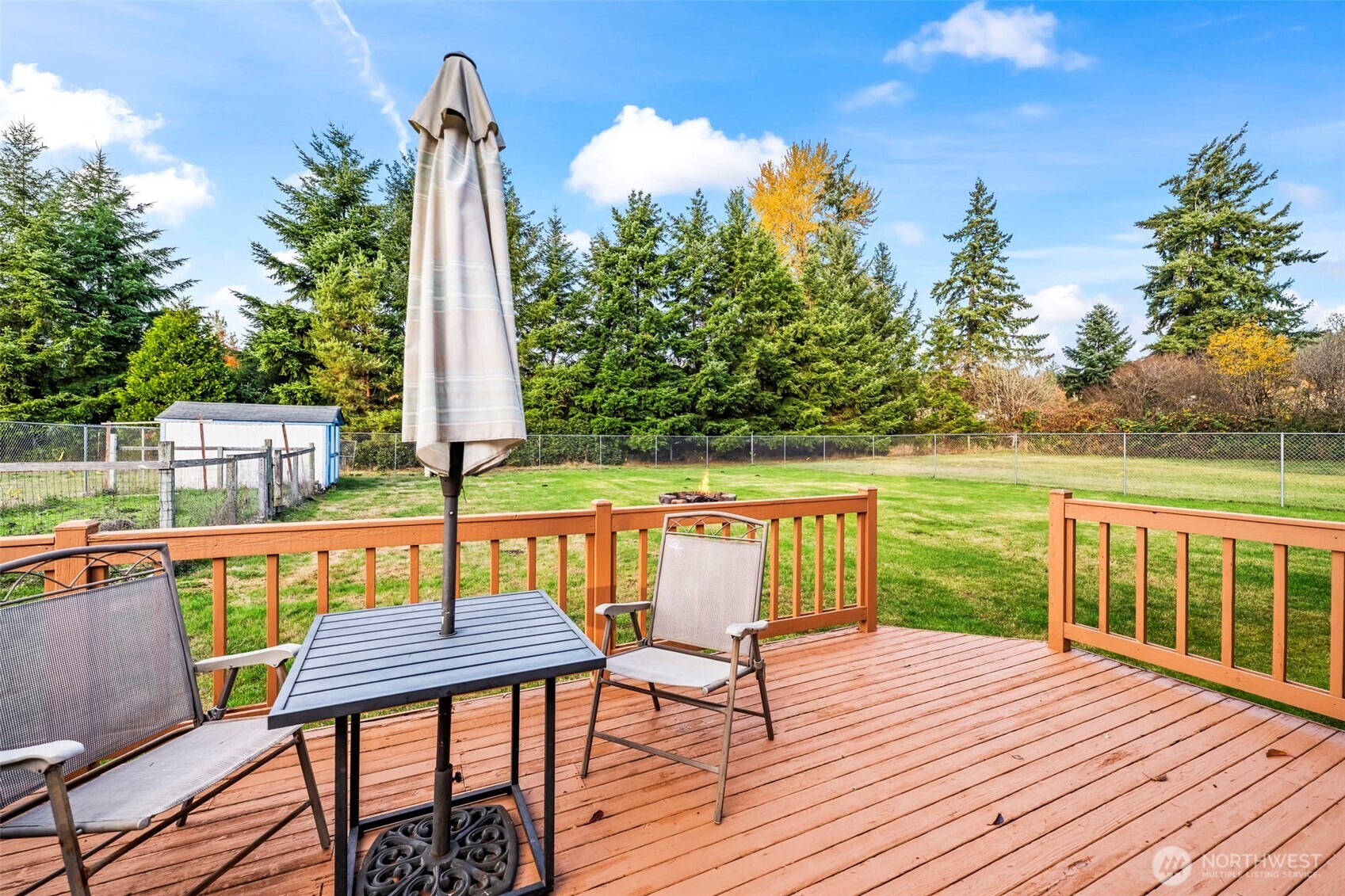 9117 336th Street South Roy, WA 98580 - Photo 33 of 38 a view of a chairs and table on the wooden deck