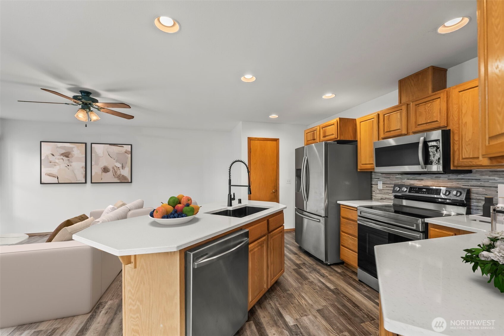 9117 336th Street South Roy, WA 98580 - Photo 9 of 38 a kitchen that has a sink and stainless steel appliances