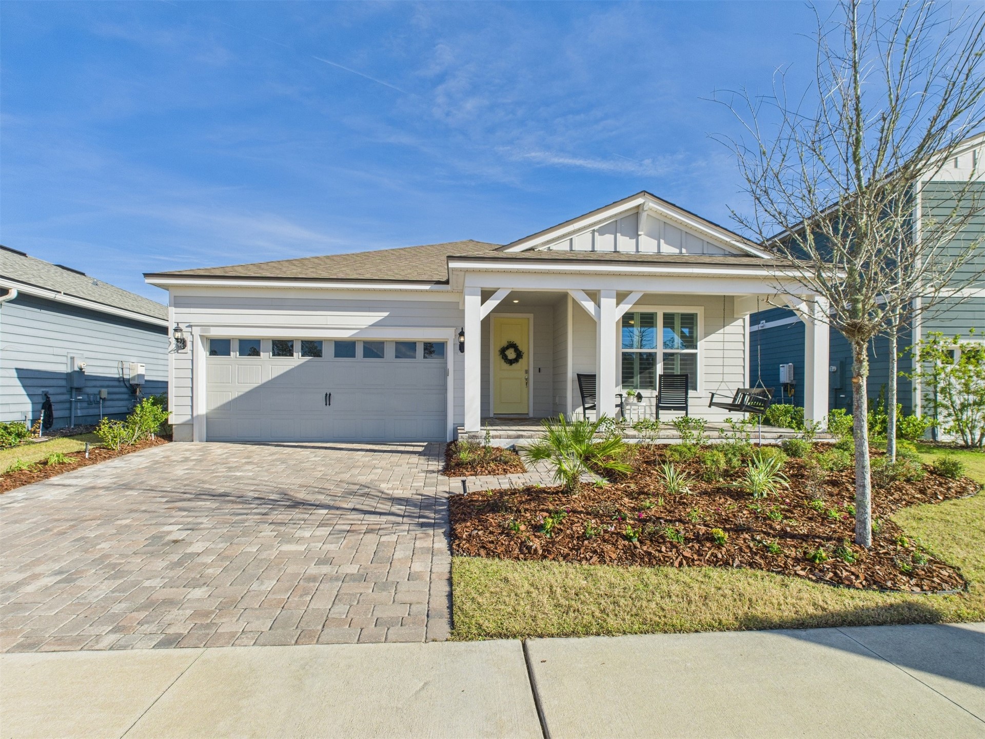 a front view of a house with garden