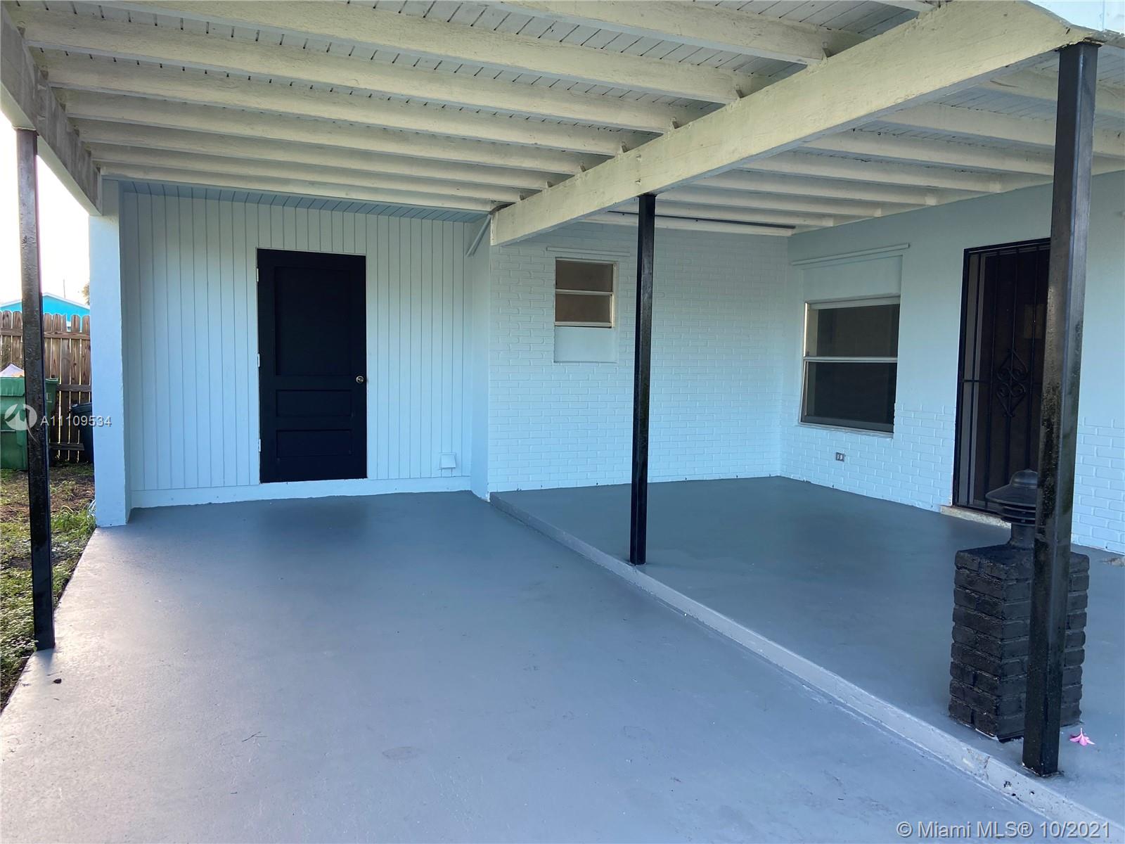 1509 Pine Tree Court Riviera Beach, FL 33404 - Photo 2 of 19 a view of an empty room