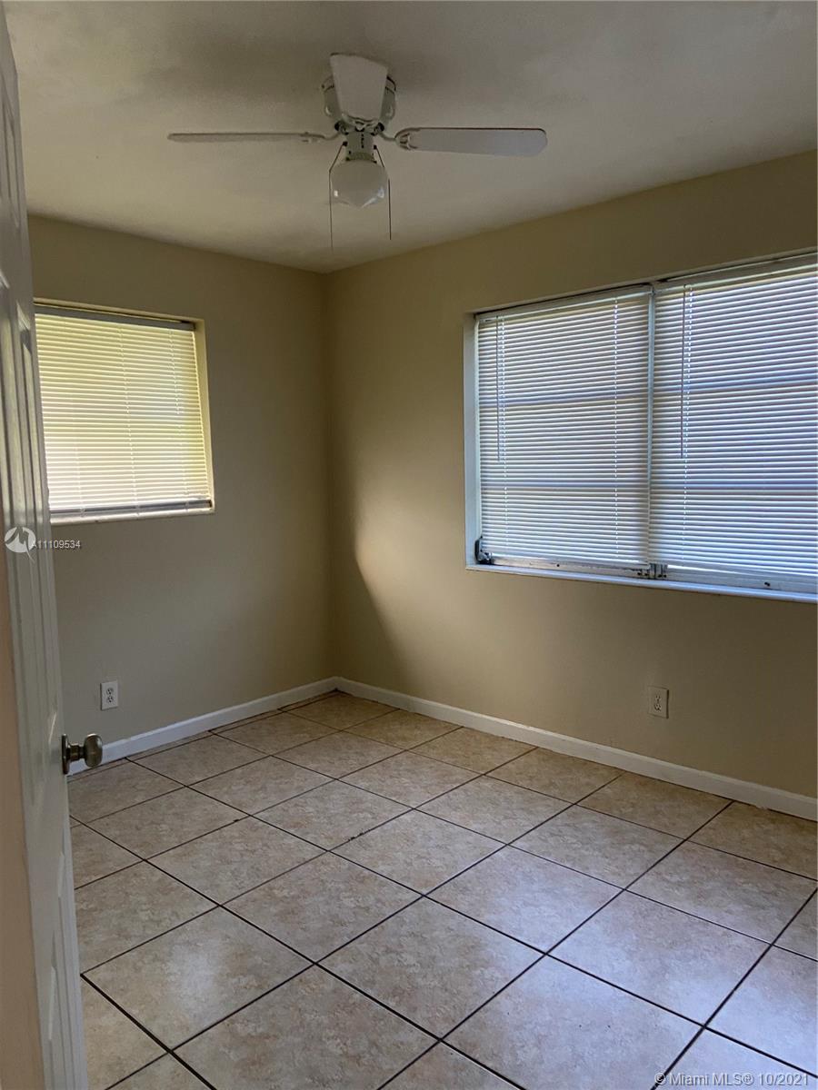 1509 Pine Tree Court Riviera Beach, FL 33404 - Photo 13 of 19 a view of an empty room