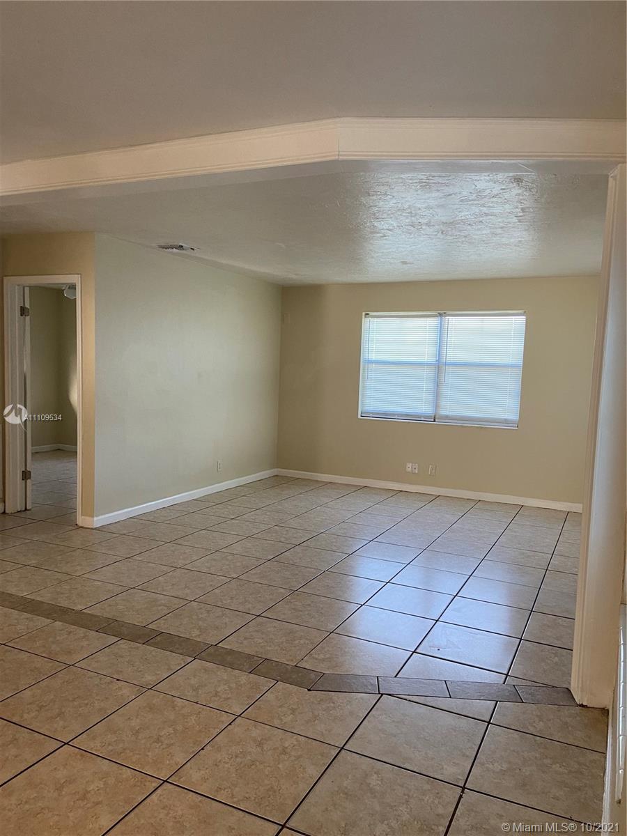 1509 Pine Tree Court Riviera Beach, FL 33404 - Photo 15 of 19 an empty room with a empty space and windows