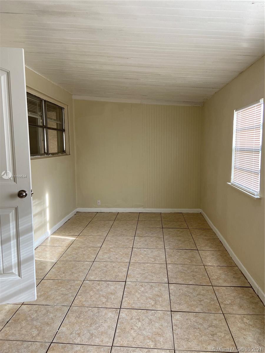 1509 Pine Tree Court Riviera Beach, FL 33404 - Photo 17 of 19 a view of a room with a sink and a window