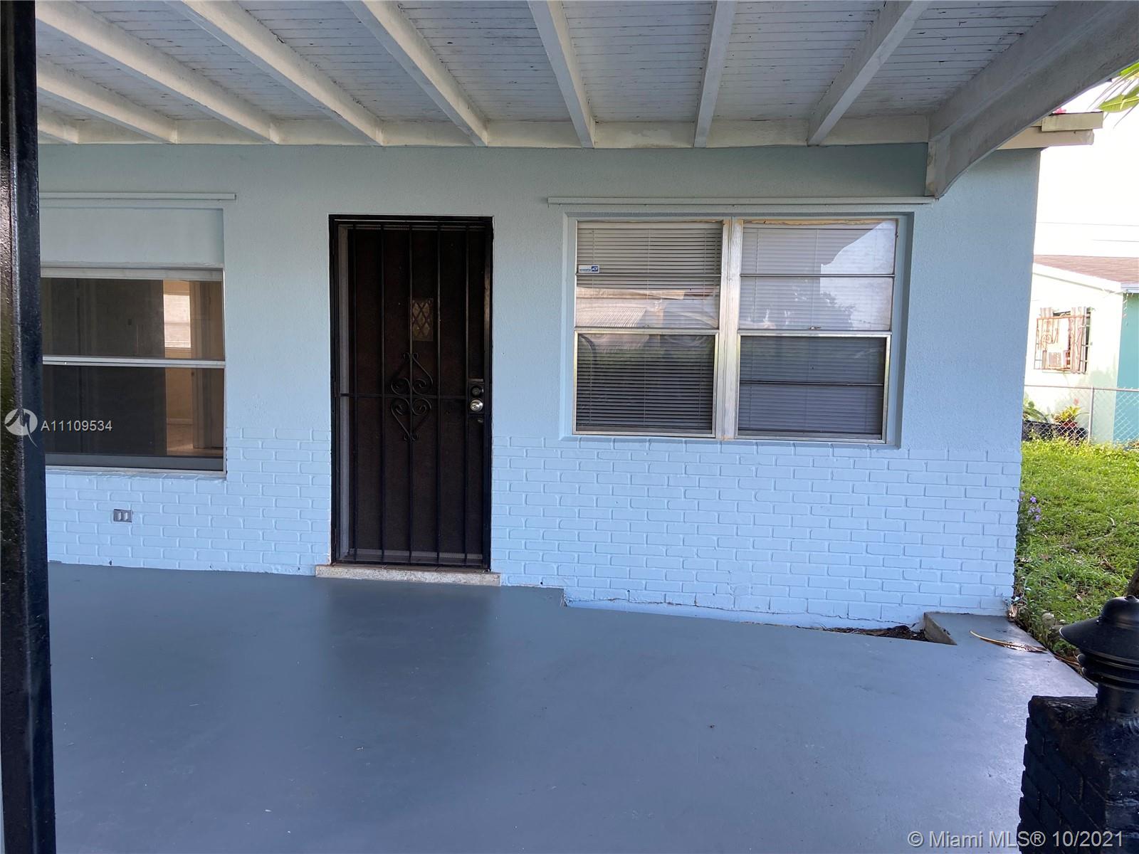 1509 Pine Tree Court Riviera Beach, FL 33404 - Photo 3 of 19 an empty room with windows