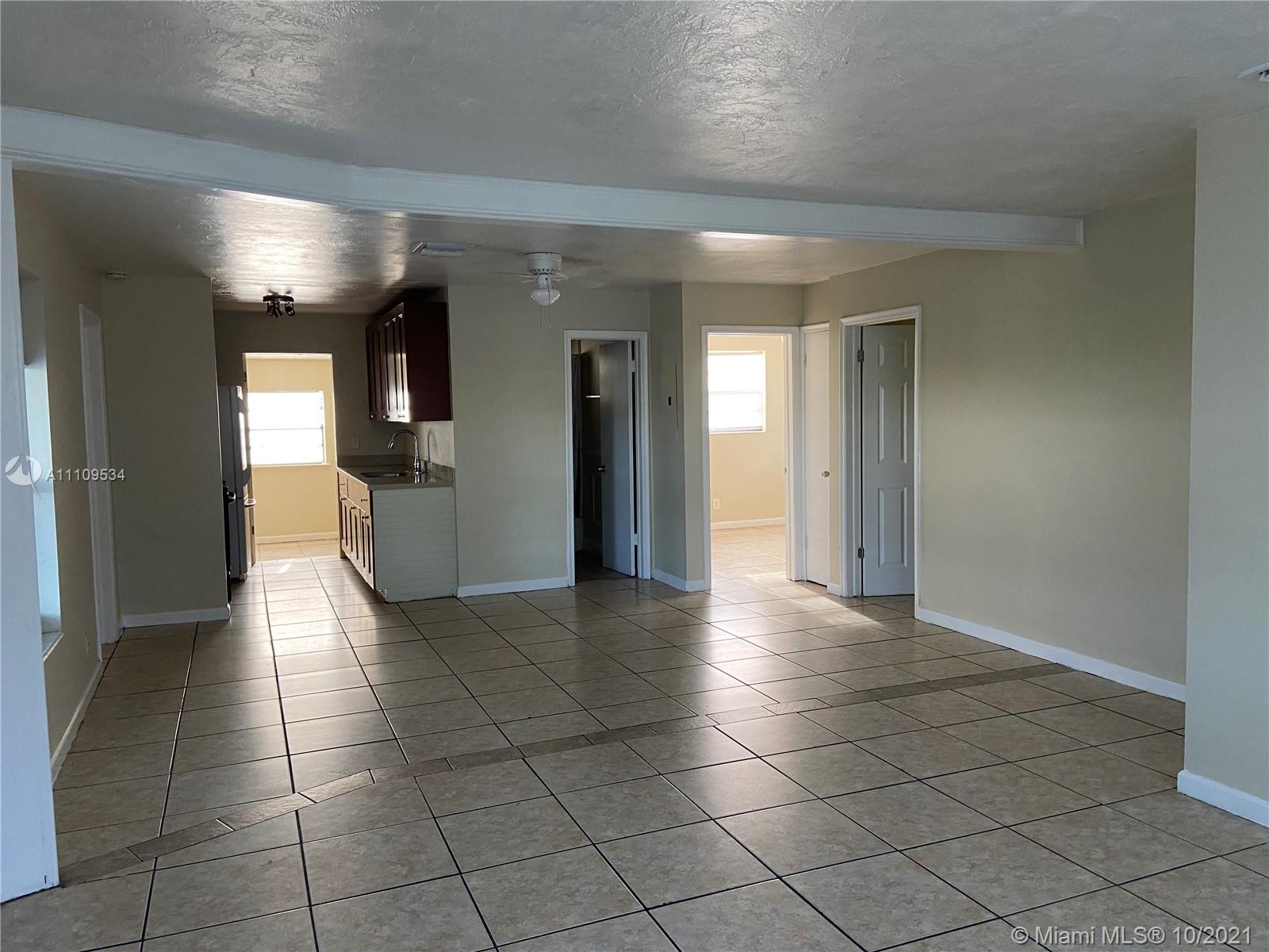 1509 Pine Tree Court Riviera Beach, FL 33404 - Photo 7 of 19 a view of a hallway