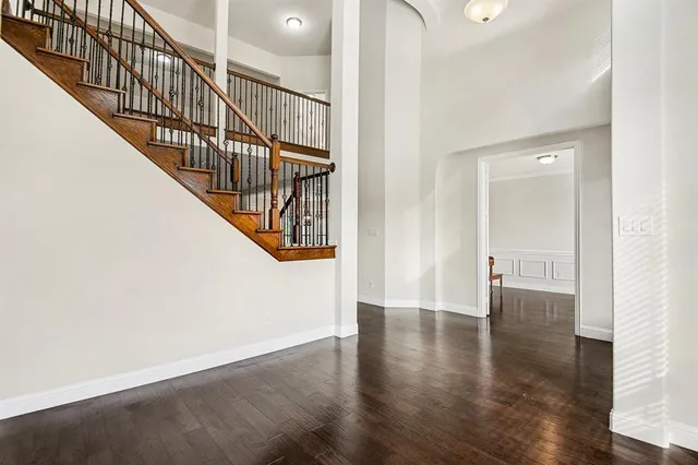a view of an entryway with wooden floor