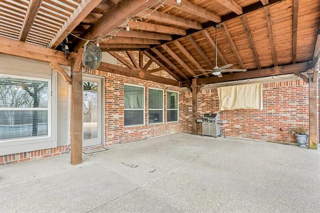 a view of a room with wooden walls