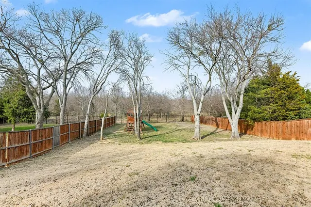 an aerial view of a house with a garden