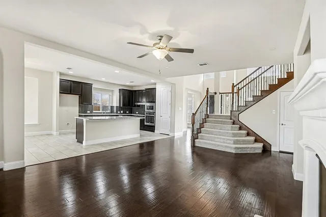 a view of kitchen with cabinets and wooden floor