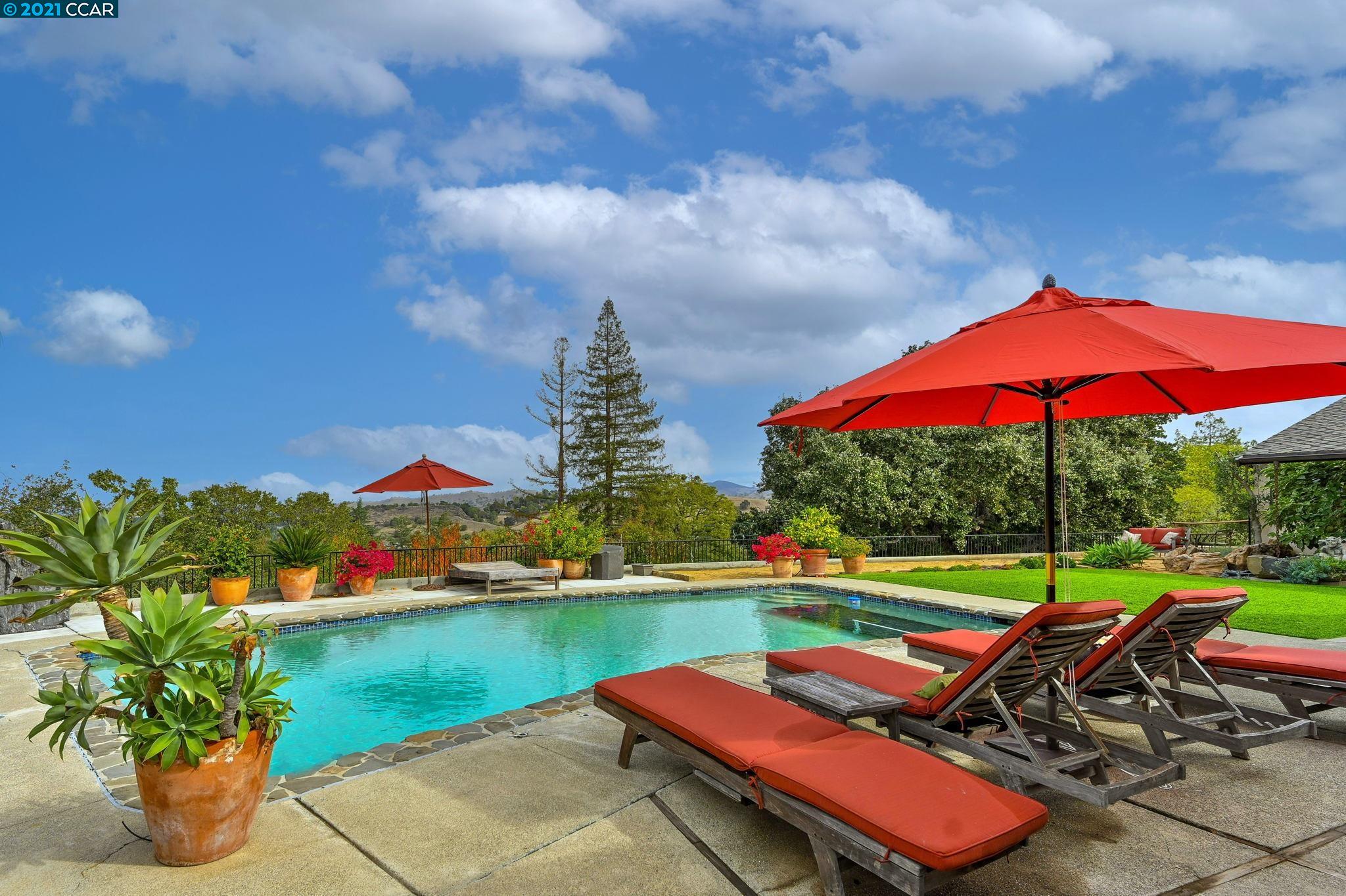 151 Castle Crest Road Alamo, CA 94507 - Photo 1 of 1 an outdoor space with furniture and umbrella