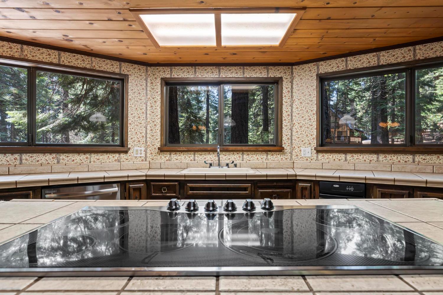 1131 Lake Ridge Road Lake Almanor, CA 96137 - Photo 16 of 55 a kitchen with a stove and a microwave
