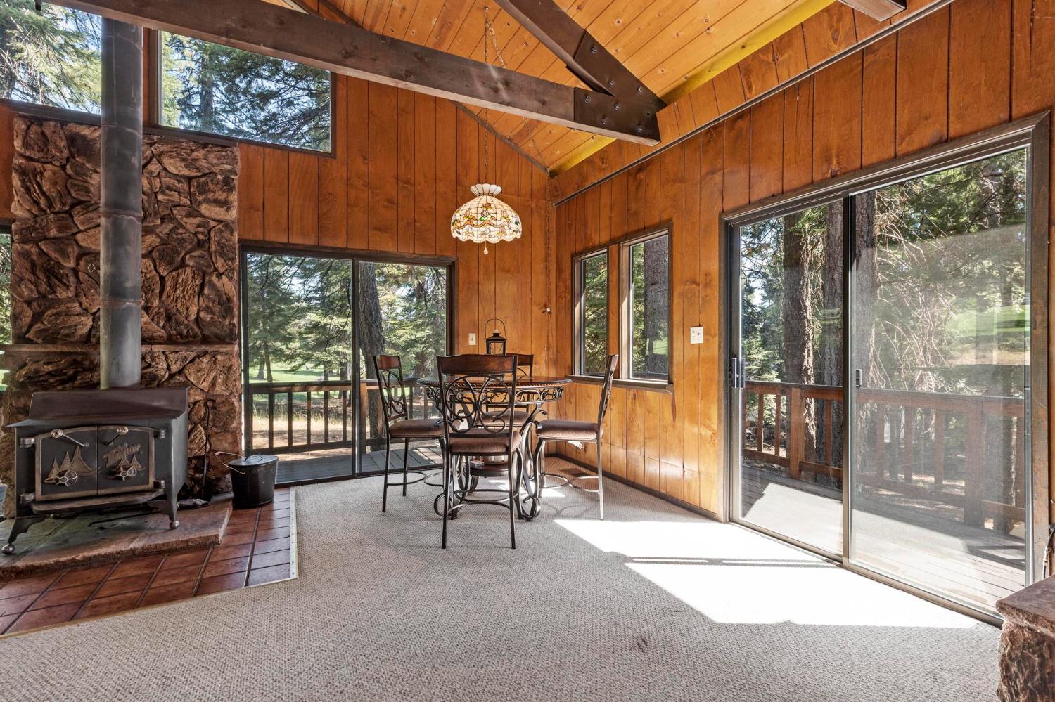 1131 Lake Ridge Road Lake Almanor, CA 96137 - Photo 20 of 55 a view of a patio with a table and chairs