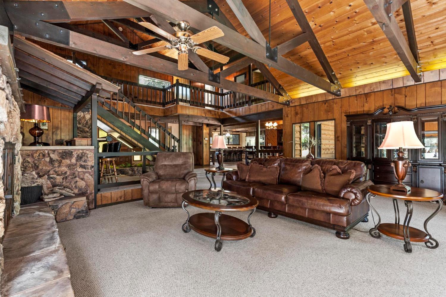 1131 Lake Ridge Road Lake Almanor, CA 96137 - Photo 23 of 55 a living room with furniture and a flat screen tv