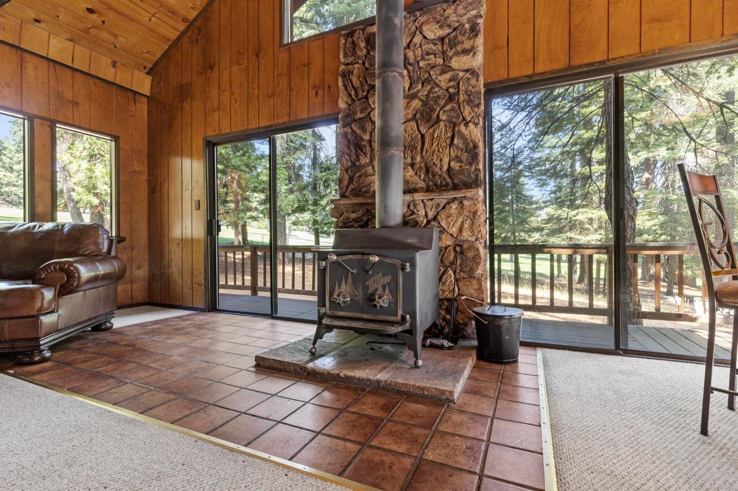 1131 Lake Ridge Road Lake Almanor, CA 96137 - Photo 24 of 55 a living room with furniture a window and a table