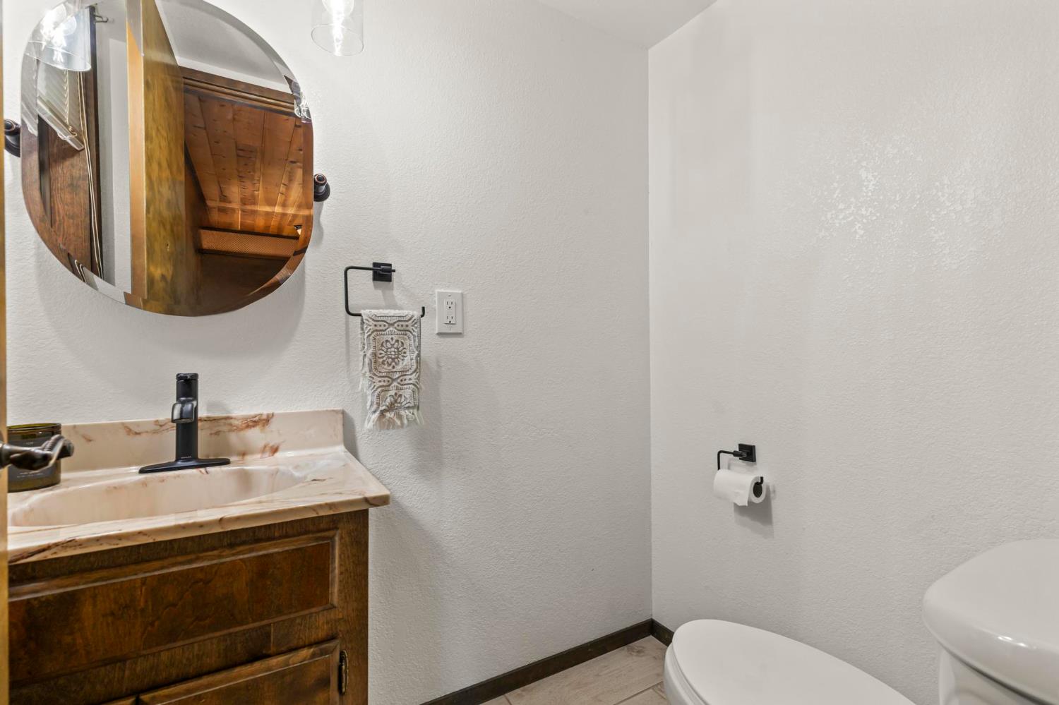 1131 Lake Ridge Road Lake Almanor, CA 96137 - Photo 27 of 55 a bathroom with a sink and a toilet