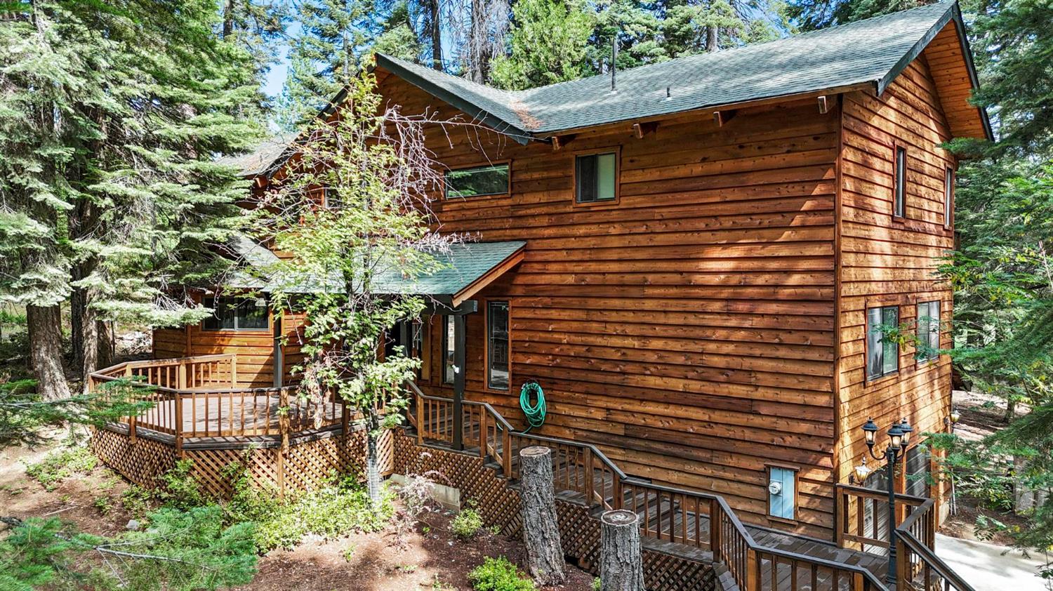 1131 Lake Ridge Road Lake Almanor, CA 96137 - Photo 4 of 55 a backyard of a house with lots of green space