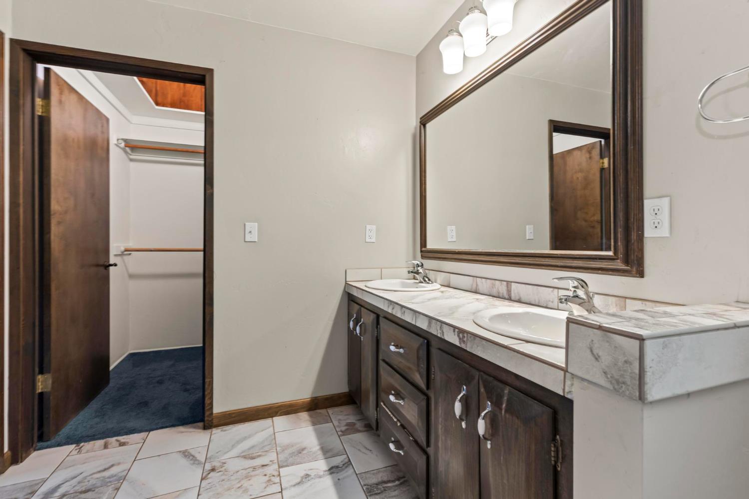 1131 Lake Ridge Road Lake Almanor, CA 96137 - Photo 41 of 55 a bathroom with a sink and a mirror