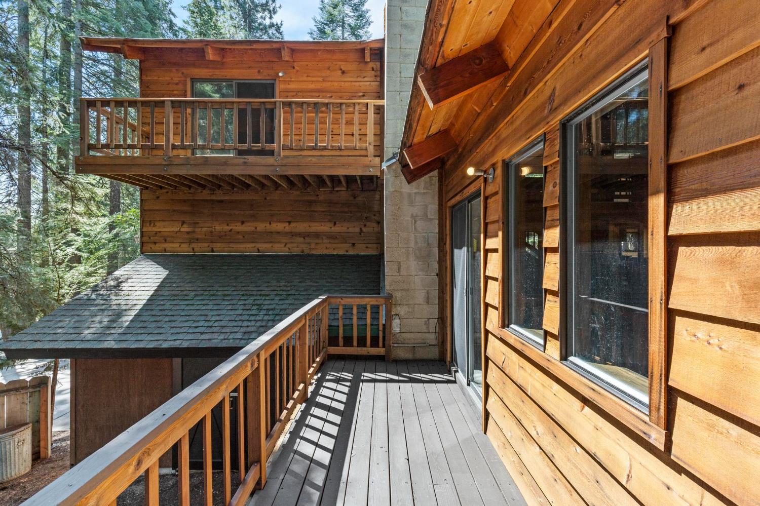 1131 Lake Ridge Road Lake Almanor, CA 96137 - Photo 43 of 55 a balcony view with wooden floor and outdoor seating
