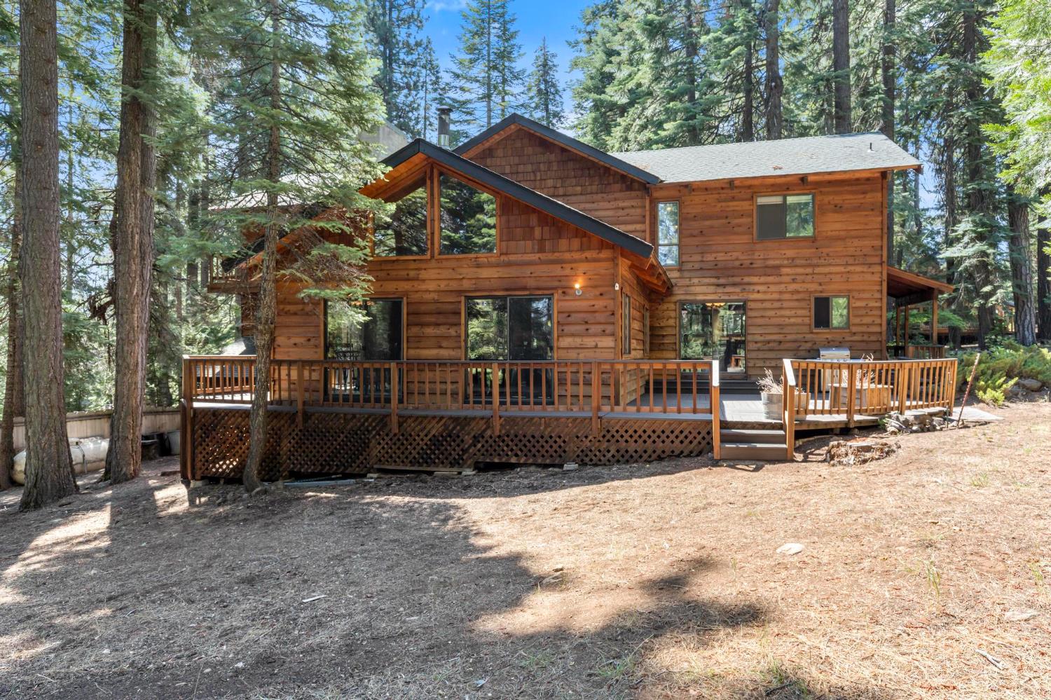 1131 Lake Ridge Road Lake Almanor, CA 96137 - Photo 47 of 55 a view of a house with backyard and sitting area
