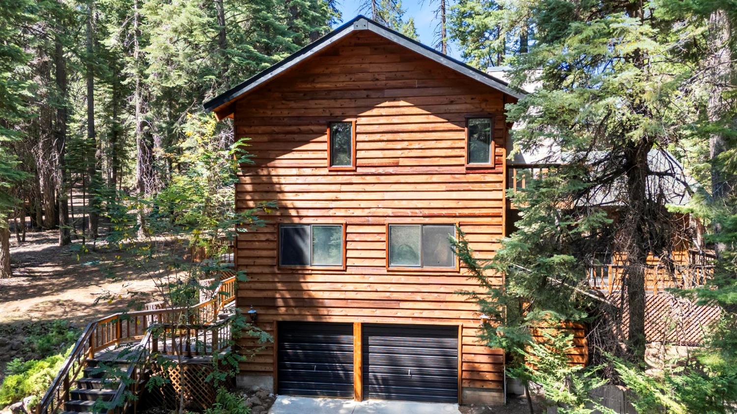 1131 Lake Ridge Road Lake Almanor, CA 96137 - Photo 5 of 55 a view of a house with a yard