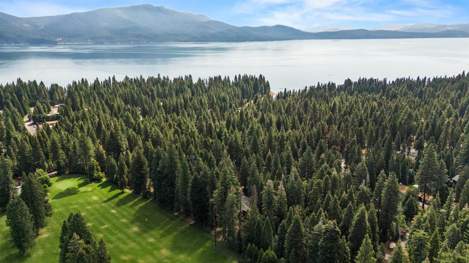 1131 Lake Ridge Road Lake Almanor, CA 96137 - Photo 53 of 55 a view of a lake from a yard
