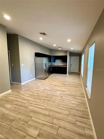 a large room with closet and a bed